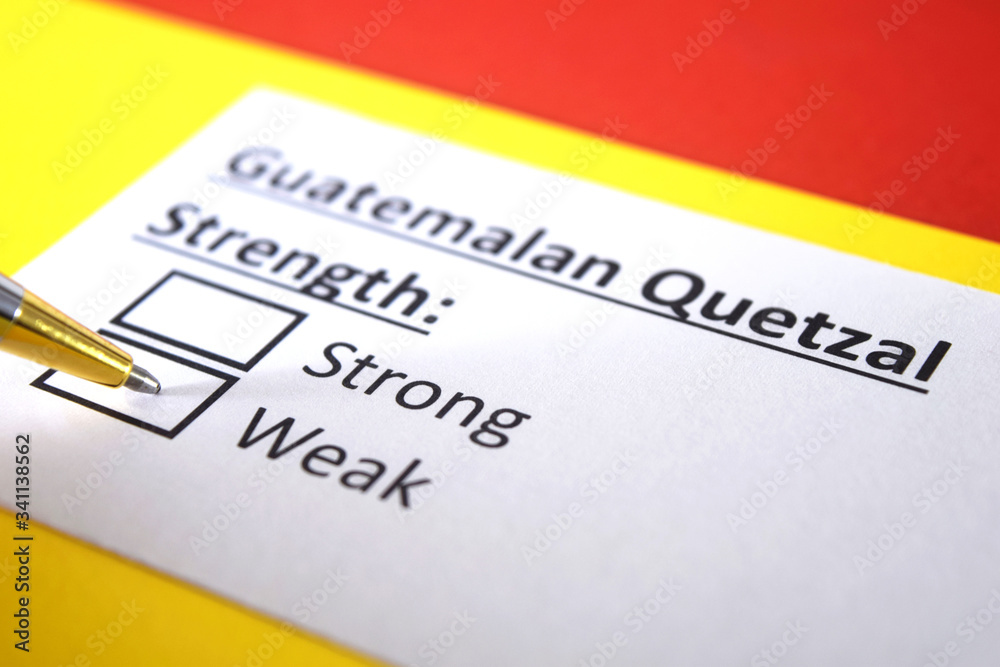 One person is answering question about strength of Guatemalan Quetzal Currency. One person is answering question about strength of Guatemalan Quetzal Currency.