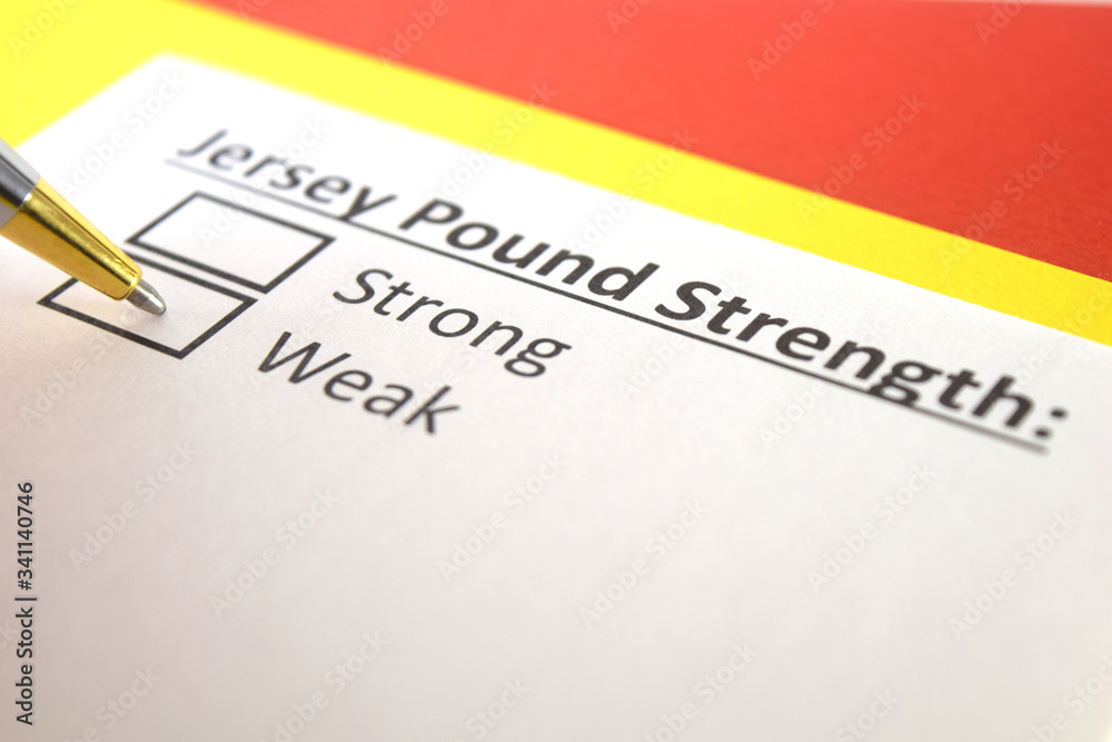 Fototapeta premium One person is answering question about strength of Jersey Pound.