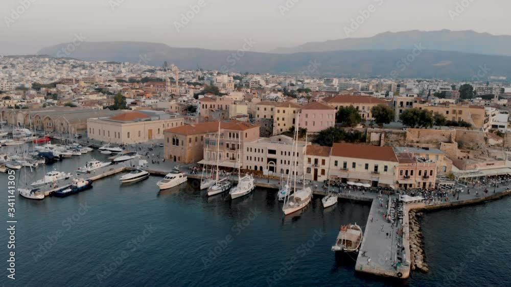 Aerial drone panoramic view video of amazing Chania old harbor during the golden hour. Crete, Greece Aerial drone panoramic view video of amazing Chania old harbor during the golden hour. Crete, Greece