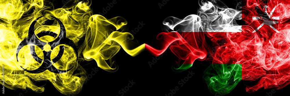 Quarantine in Oman, Omani. Coronavirus COVID-19 lockdown. Smoky mystic flag of Oman, Omani with biohazard symbol placed side by side. Quarantine in Oman, Omani. Coronavirus COVID-19 lockdown. Smoky mystic flag of Oman, Omani with biohazard symbol placed side by side.