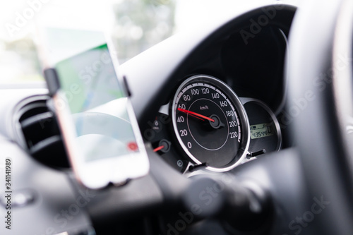 Close-up of car speedometer at speed of 60 kilometers per hour