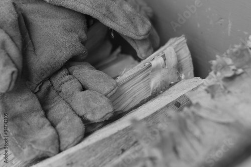 gloves on chopped wood