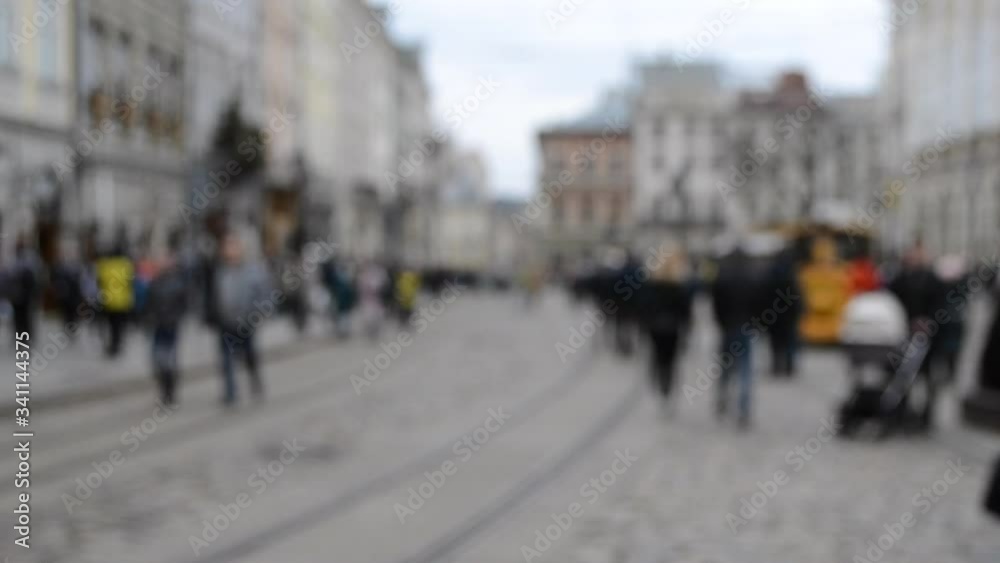 Blurred Background of many people on street square city town Blurred Background of many people on street square city town