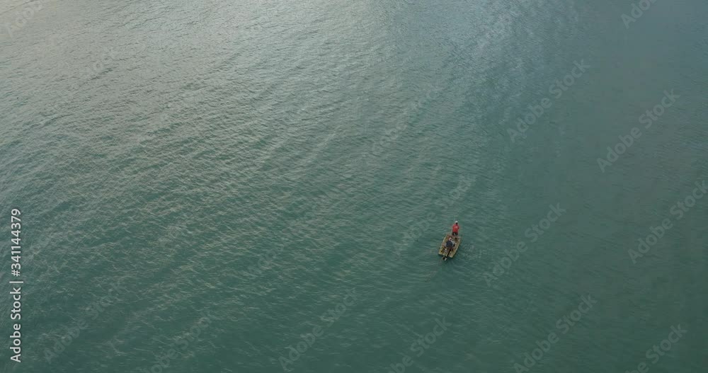 sunrise fisherman on the green sea