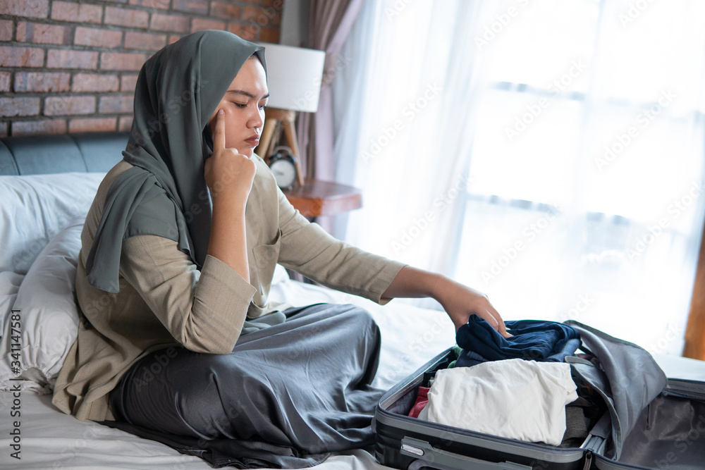 Young Muslim women are sad because they cannot go home because some area lockdown activity for travelers