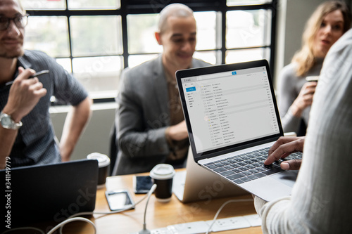 Wall Mural Man checking his email on a laptop