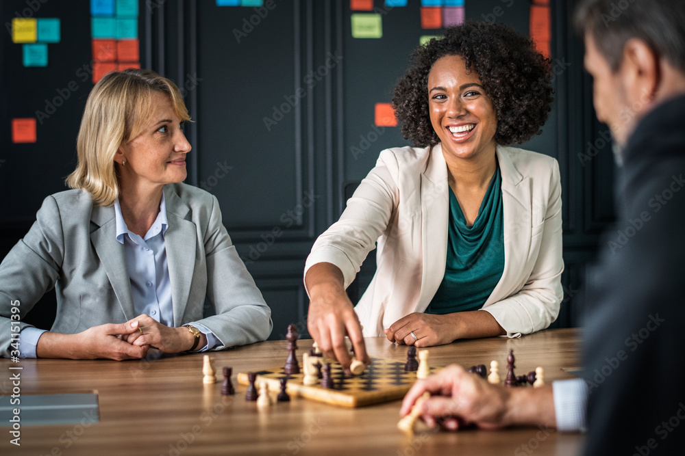 Fototapeta premium Buiness friends playing a game of chess