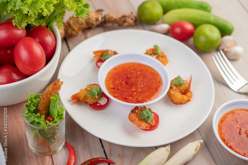 Shrimp deep-fried batter arranged beautifully in a white dish. Shrimp deep-fried batter arranged beautifully in a white dish.