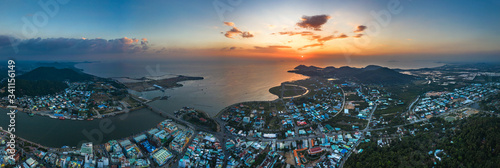 Top view aerial of Ha Tien City with development buildings, transportation, energy power infrastructure. Famous tourist city of Vietnam, sharing the border with Cambodia photo