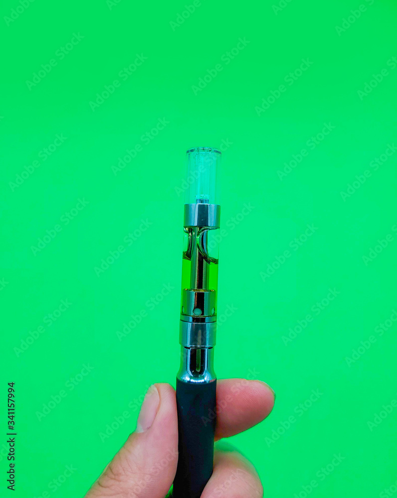 Vape Pen on hand. Cannabis oil vape pen cartridges. Alternative method ...