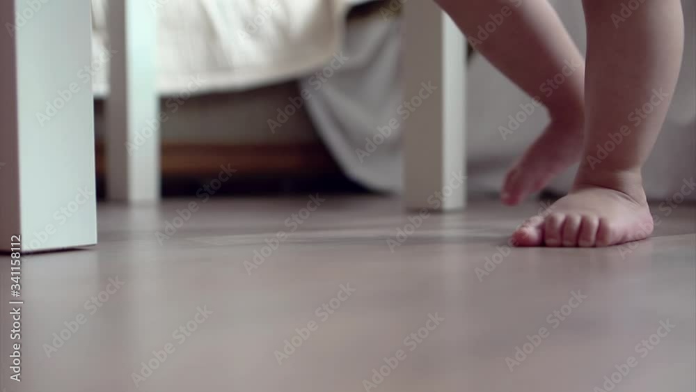 Legs of a newborn baby close-up. First step. foot massage, childhood concept, health care, IVF, hygiene, training, childhood Legs of a newborn baby close-up. First step. foot massage, childhood concept, health care, IVF, hygiene, training, childhood