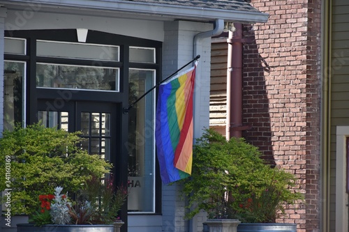 LGBT Rainbow flag hanging in front of a building