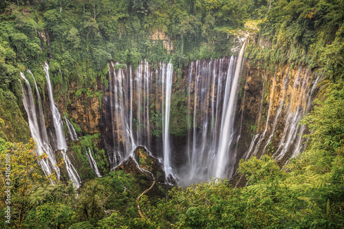A large waterfall in a jungle. Tumpac Sewu. West Java. Indonesia. lost world. wild world. nature