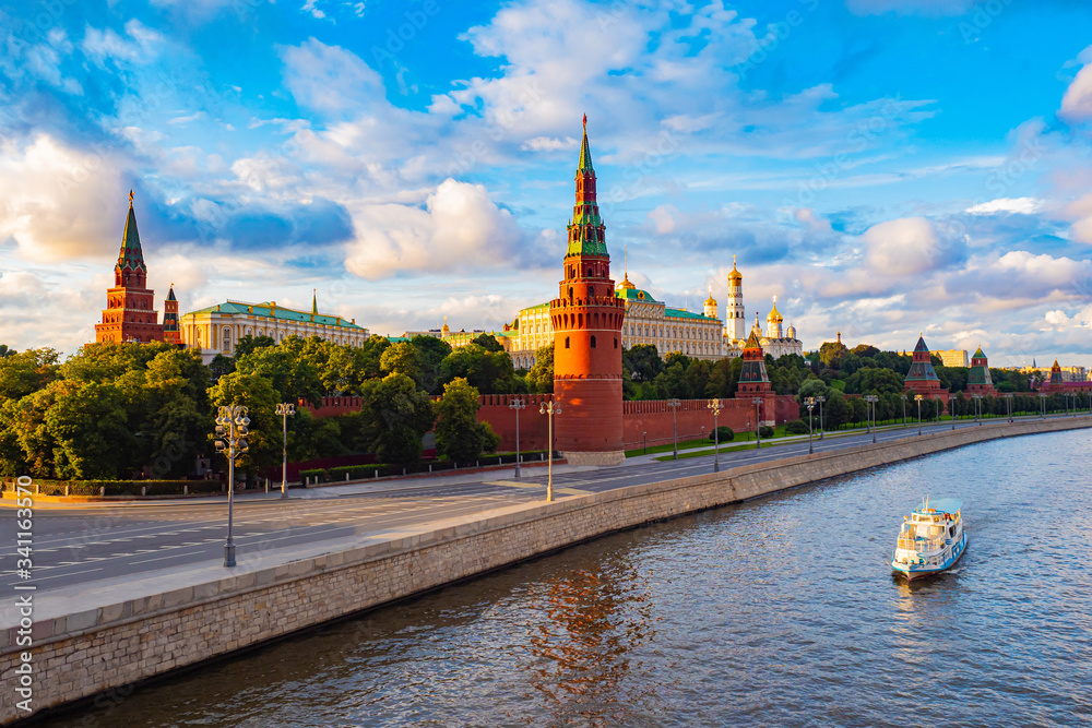 Moscow. Russia. View of the Moscow Kremlin from the Moscow river. Red brick towers. Grand Kremlin palace. Water trip to the capital of Russia. Bell Tower Of Ivan The Great.