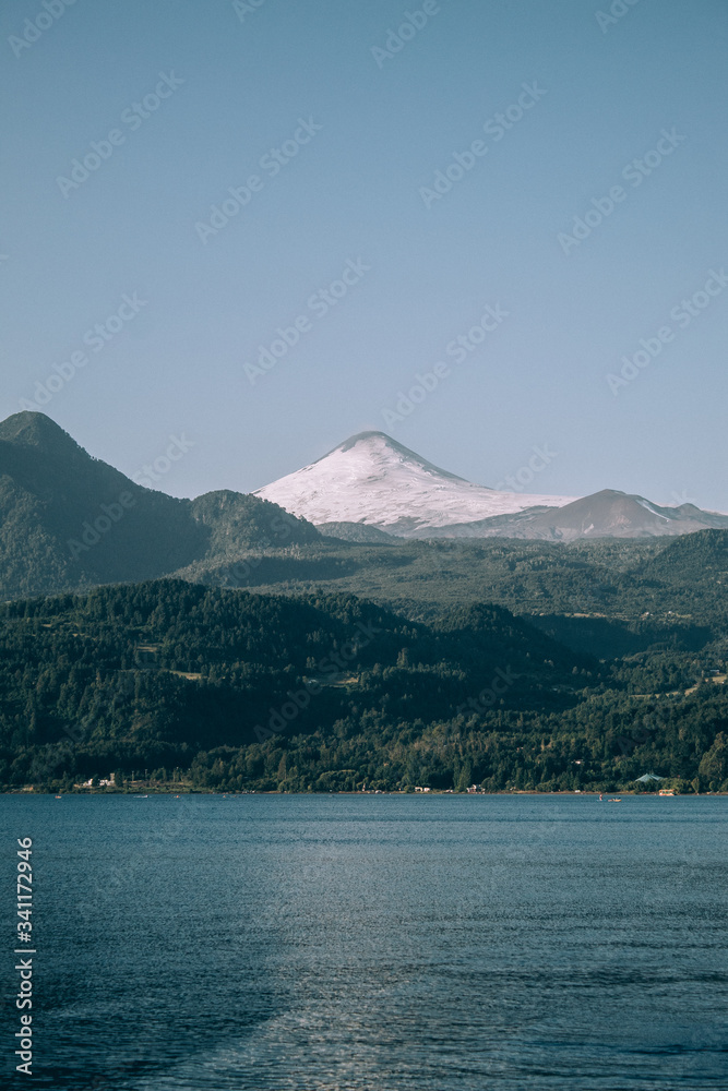 beautiful views of hills, mountains and cabins in the middle of a lake beautiful views of hills, mountains and cabins in the middle of a lake