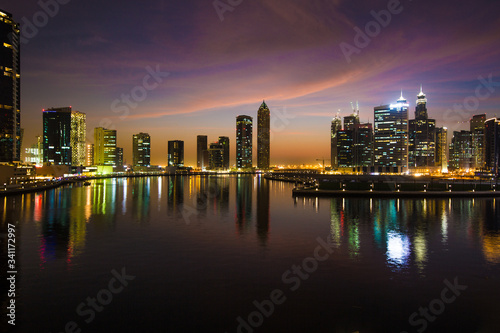Sunrise over pond in a city. Kuala Lumpur skyline