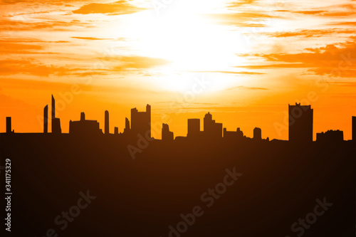 city silhouette and sky on sun ray  silhouetted Bangkok city with sunrise or sunset.