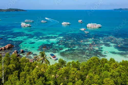 Aerial view of people swimming on the sea and beach on Gam Ghi Phu Quoc island in Thailand bay, Kien Giang, Vietnam. photo