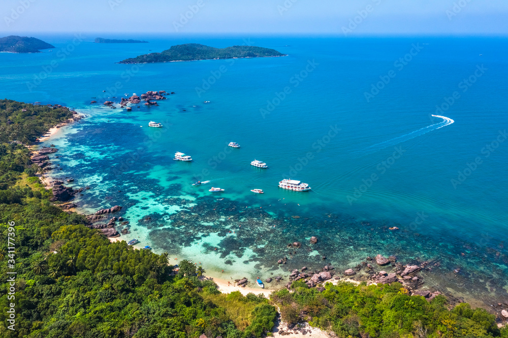 Aerial view of people swimming on the sea and beach on Gam Ghi Phu Quoc island in Thailand bay, Kien Giang, Vietnam. Aerial view of people swimming on the sea and beach on Gam Ghi Phu Quoc island in Thailand bay, Kien Giang, Vietnam.