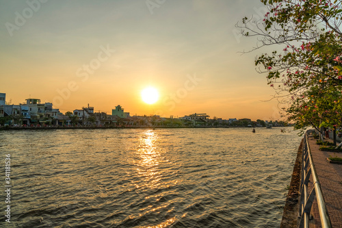 River and Riverside road in Sa Dec, Dong Thap, Vietnam. Urban in the Mekong Delta