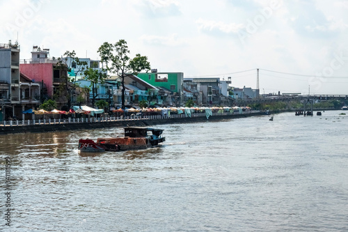 River and Riverside road in Sa Dec, Dong Thap, Vietnam. Urban in the Mekong Delta © Hien Phung