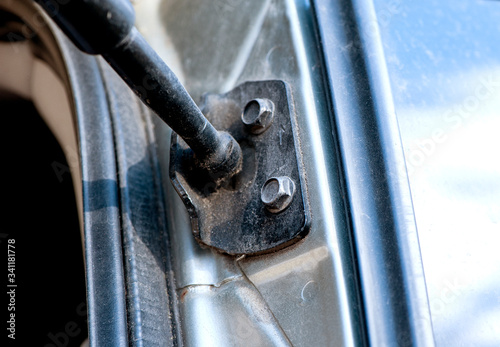 Car trunk rack bracket. Dirty auto parts, car repair. close-up selective focus. Macro photography