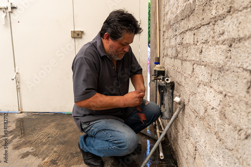 Man fixing a tube