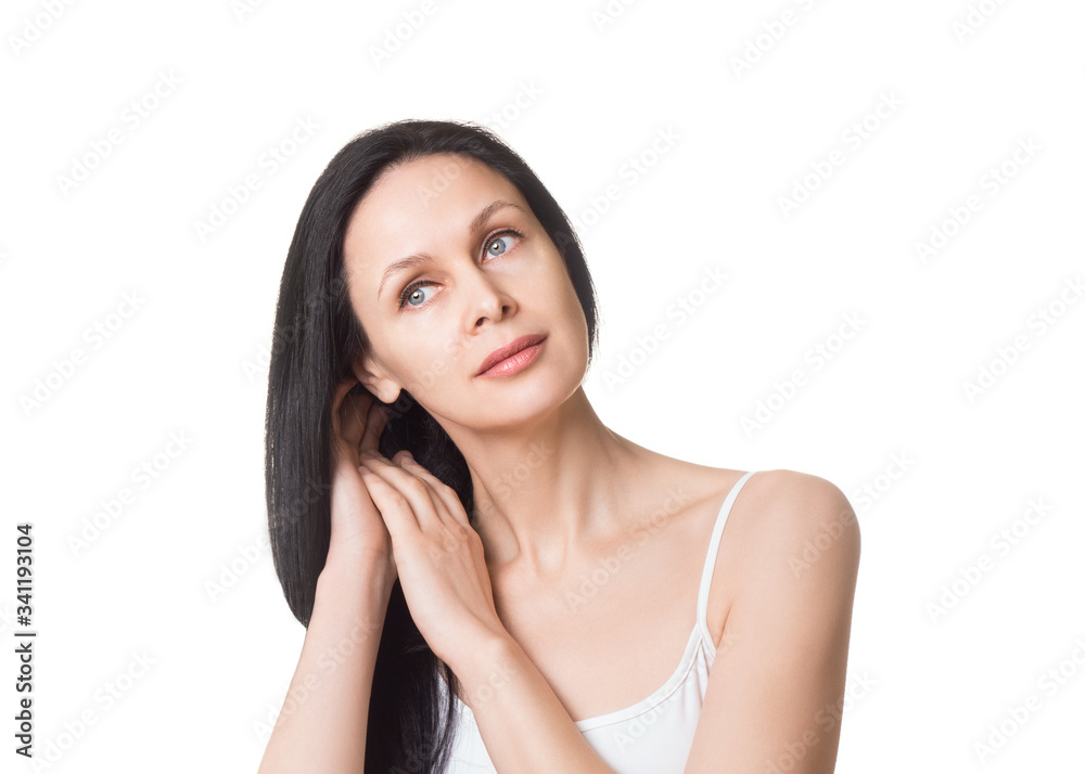 Caucasian attractive female face with long loose black hair and bare shoulders, close up. Adult woman touches her hair with hands, natural beauty, isolated on white. Caucasian attractive female face with long loose black hair and bare shoulders, close up. Adult woman touches her hair with hands, natural beauty, isolated on white.