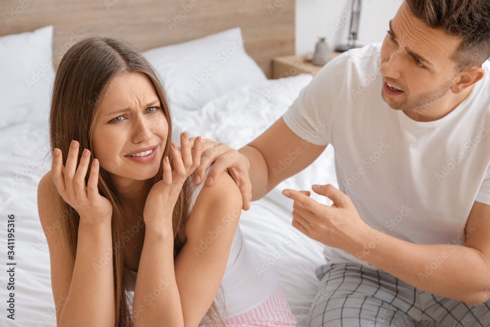 Young couple quarreling in bedroom Young couple quarreling in bedroom