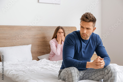 Sad couple after quarrel in...
