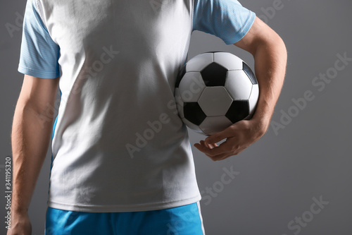 Silhouette of male football player on dark background