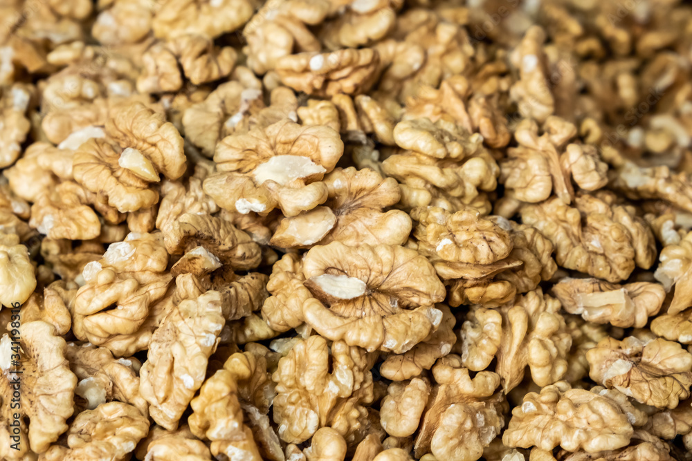 Background made of nuts. Peeled walnuts in the market. Healthy, wholesome food. Organic products. Source of vitamins and minerals. Grocery market in Georgia. Background made of nuts. Peeled walnuts in the market. Healthy, wholesome food. Organic products. Source of vitamins and minerals. Grocery market in Georgia.