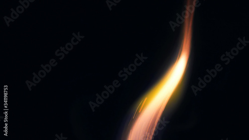 Macro photo of Bonfire sparks. Fire Flames bursts, blasts. Explosion micro sparkles. Mini Fireworks. Shooting on Red camera still on black background. Spark poster, banner, wallpaper, texture.