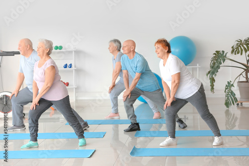 Elderly people exercising i...