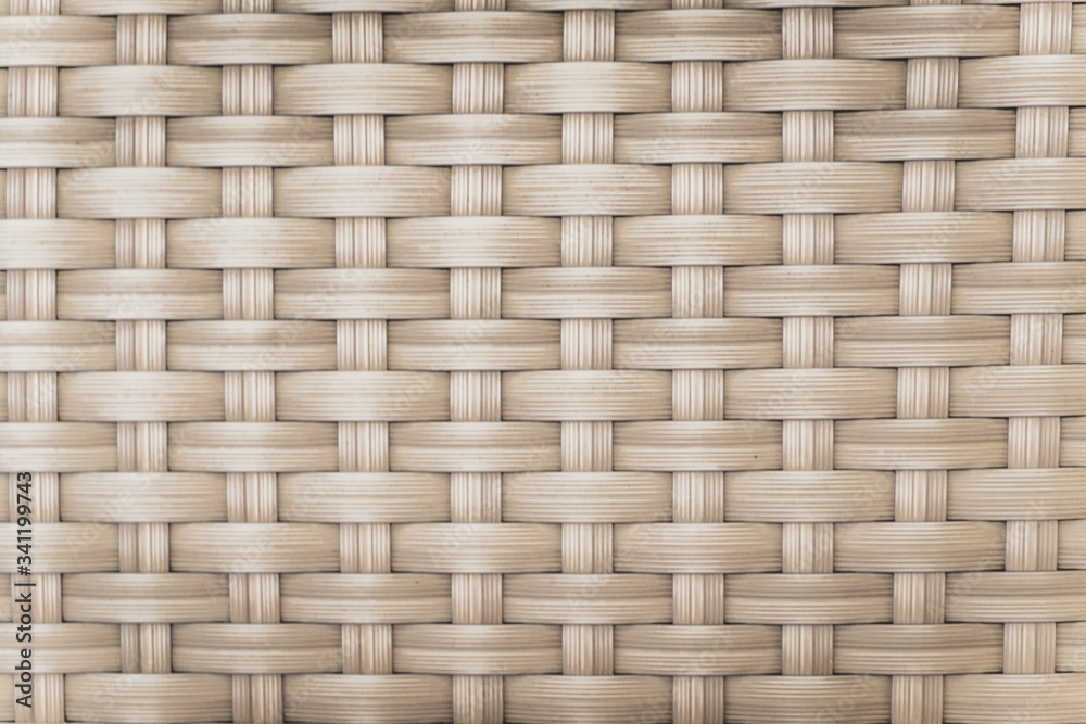 Abstract background of wicker stripes of matting. Texture and patterns handmade. Outdoor furniture close-up. Abstract background of wicker stripes of matting. Texture and patterns handmade. Outdoor furniture close-up.