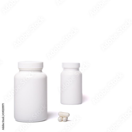 White containers with no logo. Boxes with ccccapsules isolated on a white.