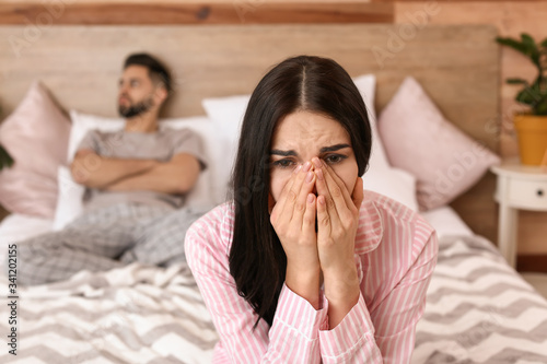 Sad couple after quarrel in...