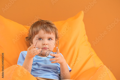 Cute little boy with eyegla...