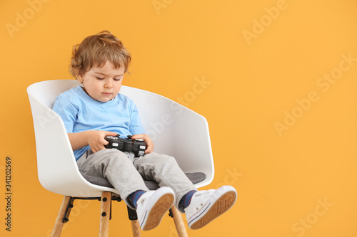 Cute little boy with game p...