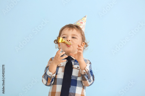 Cute little boy with party ...
