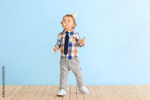 Cute little boy with party ...