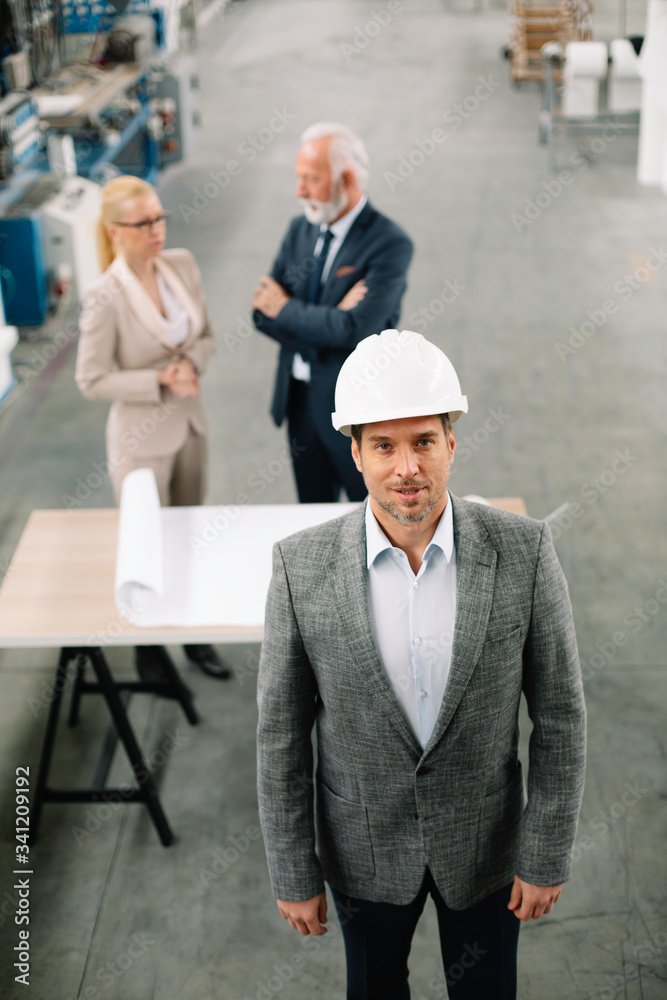 Portrait of handsome businessman. Man working in factory. Portrait of handsome businessman. Man working in factory.