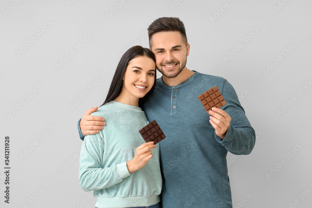 Fototapeta premium Couple enjoying chocolate, sweet treats and indulgence, happy relationship and sharing moments