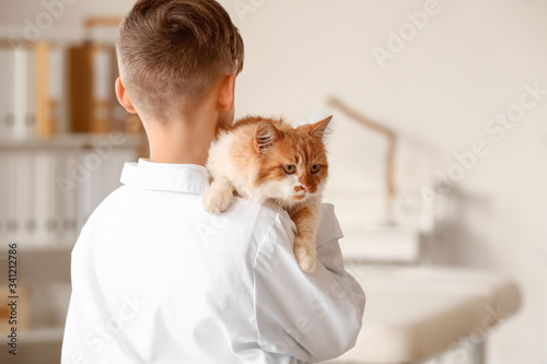 Little veterinarian with cu...