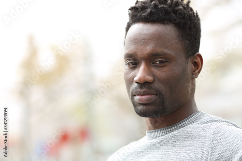 Serious confident black man posing looking camera
