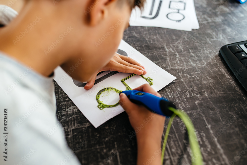 Child using 3D printing pen. Boy making new item. Creative, technology ...