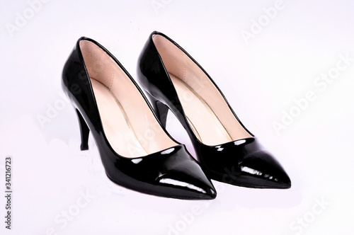 Beautiful elegant shoes for women black patent leather high heels on a white background