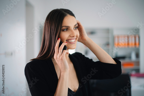 Female manager at the office. Beautiful woman preparing for the meeting.