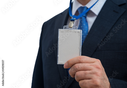Fototapeta Businessman in suit wearing a blank ID tag or name card on a lanyard at an exhibition or conference
