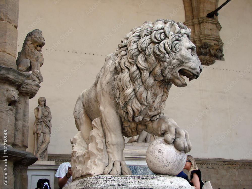 The sculpture of the king of beasts as a symbol of mighty power in one of the central squares of the medieval city.